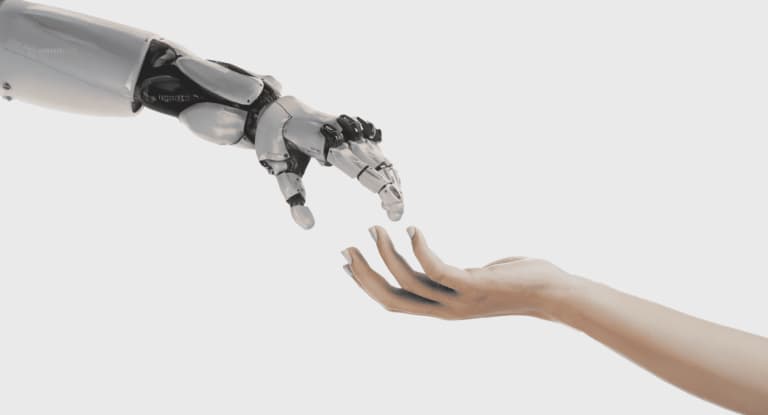 Robotic hand reaching toward human hand symbolizing technology and human collaboration.